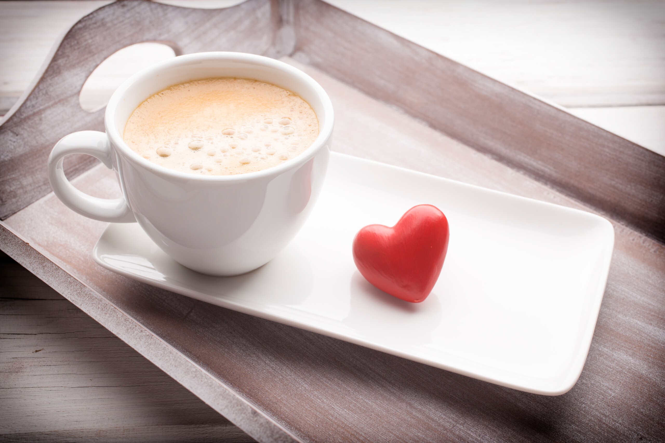 Hearts and coffee on the table, greeting card.