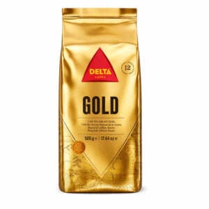 DELTA CAFES GOLD 500 g neskaldytų kavos pupelių maišelis su auksiniu dizainu ir raudonu trikampio logotipu.
