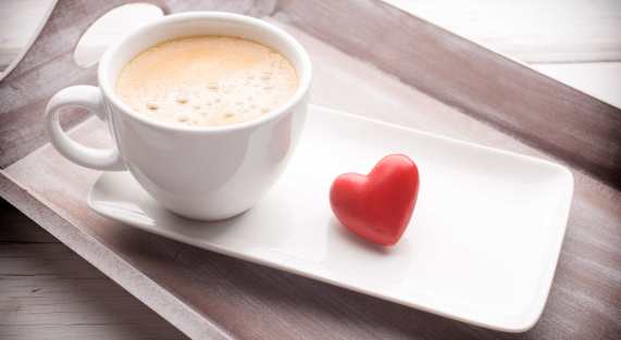 Hearts and coffee on the table, greeting card.